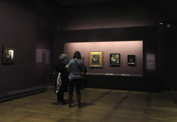 women gazing at Vermeer exhibition