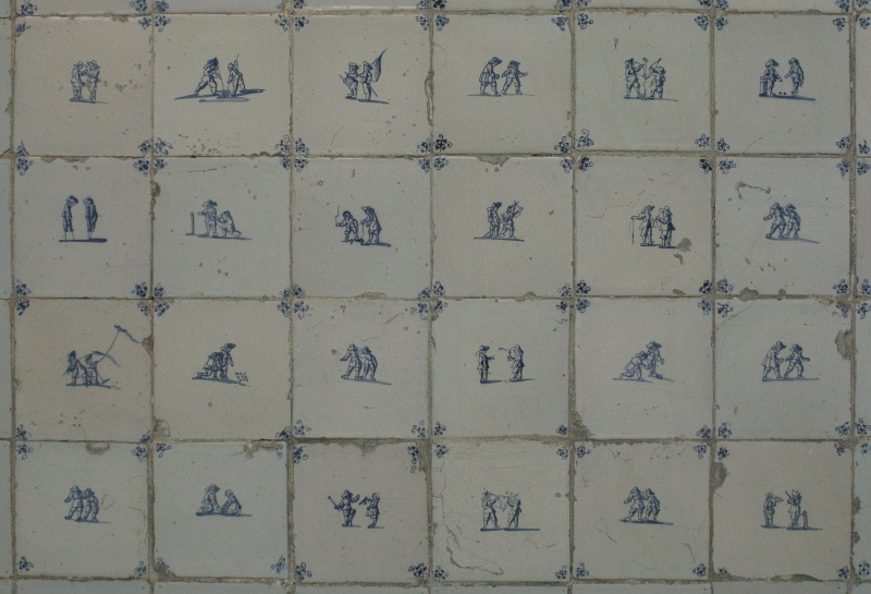 Delft baseboard tiles featuring children playing games
