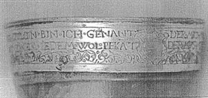 gilded bell band with the inscription on a dulcian